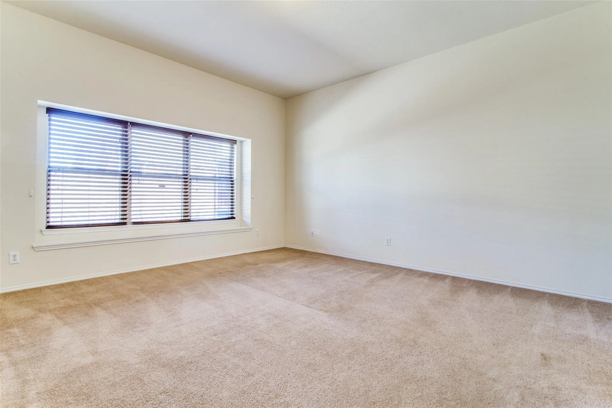 Primary bedroom on the first floor separate from the guest bedroom downstairs.