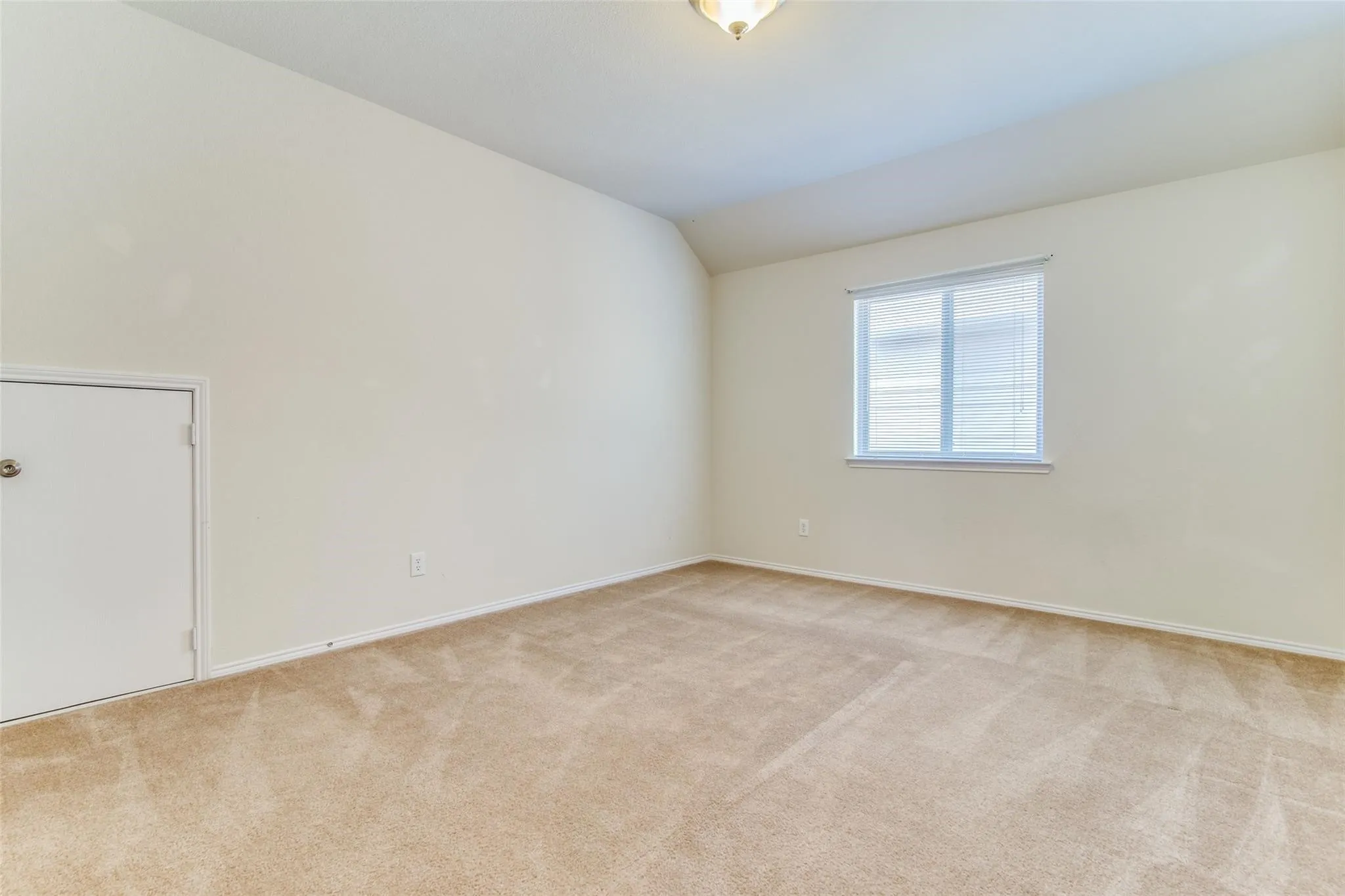 Primary bedroom on the first floor separate from the guest bedroom downstairs.