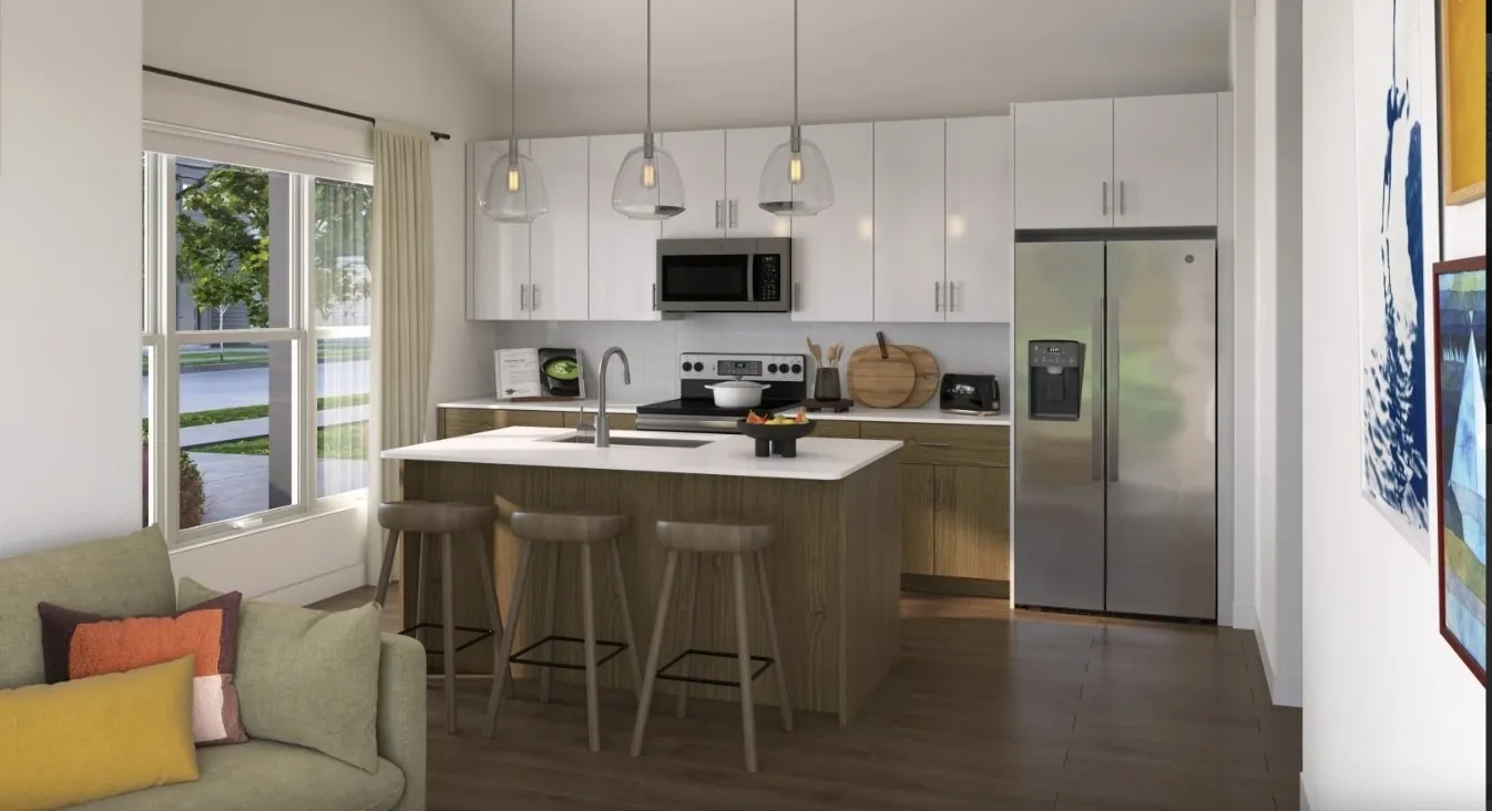 Kitchen with stainless steel appliances, a breakfast bar, white cabinets, hanging light fixtures, and open floor plan