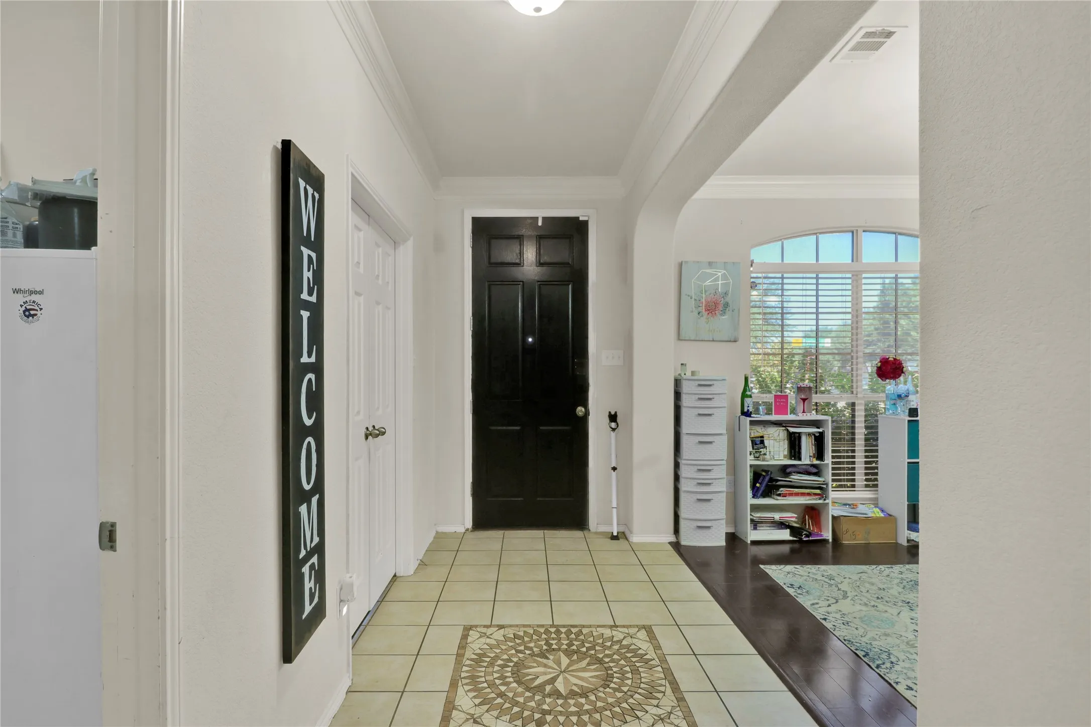Entry with office to left and formal dining to right.