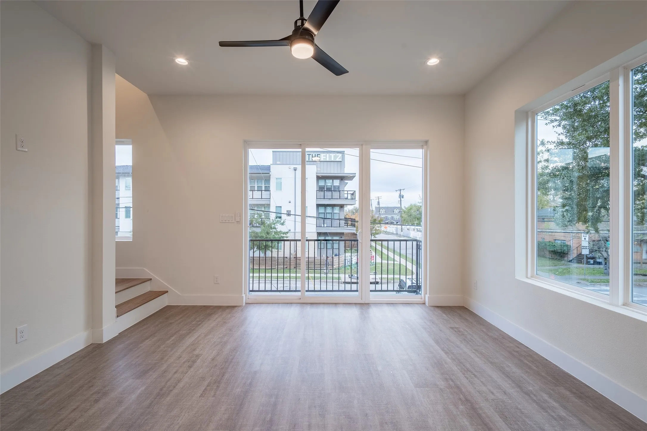 Room featuring ceiling fan, a healthy amount of sunlight, and light wood-type flooring