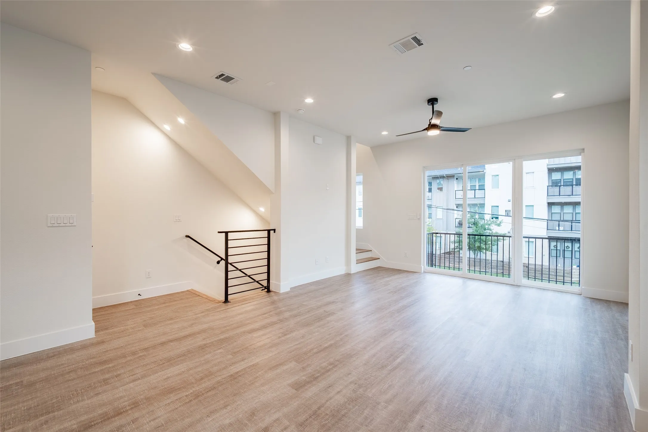Unfurnished room with light hardwood / wood-style flooring and ceiling fan