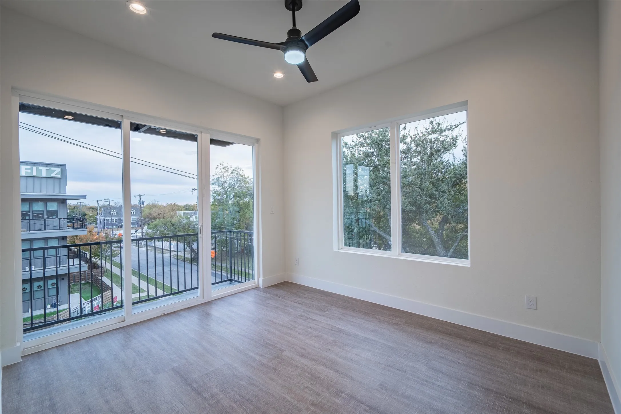 Empty room featuring ceiling fan and wood-type flooring