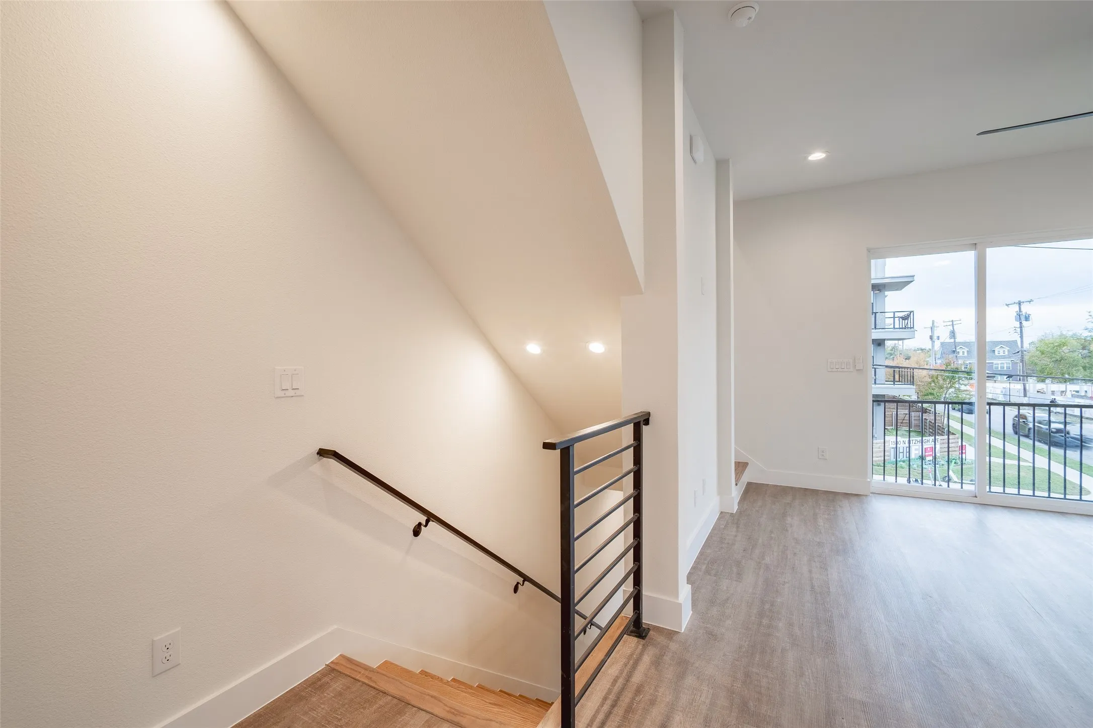 Stairway with hardwood / wood-style floors