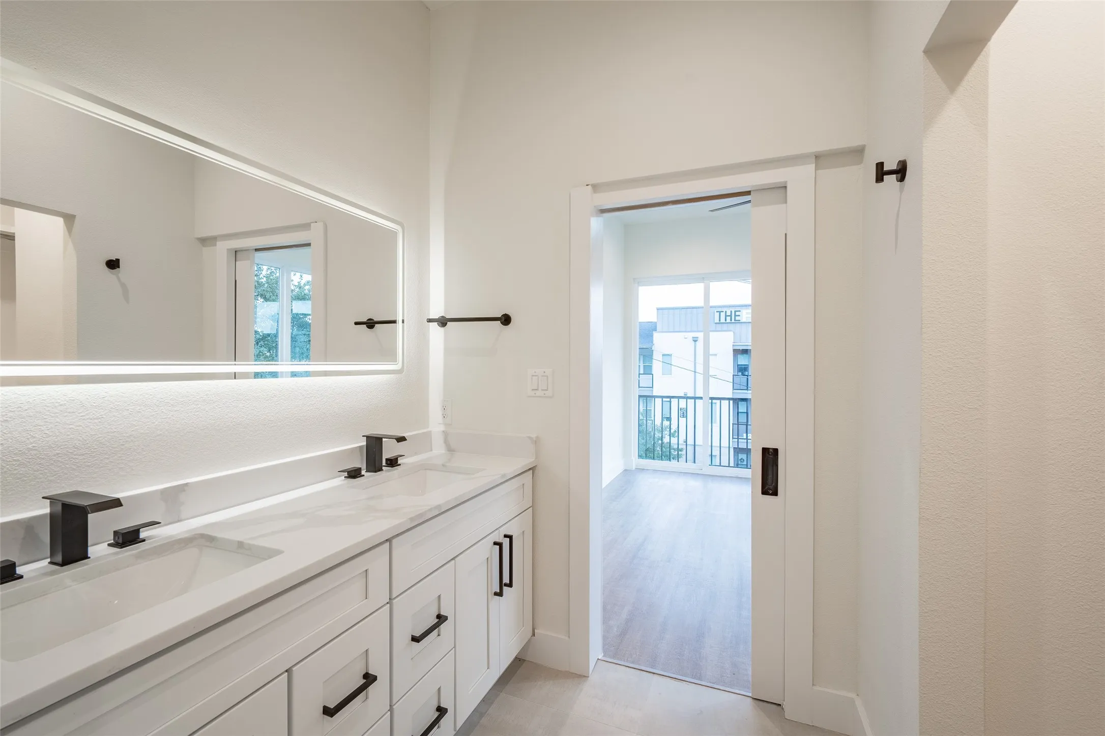 Bathroom with vanity and hardwood / wood-style flooring