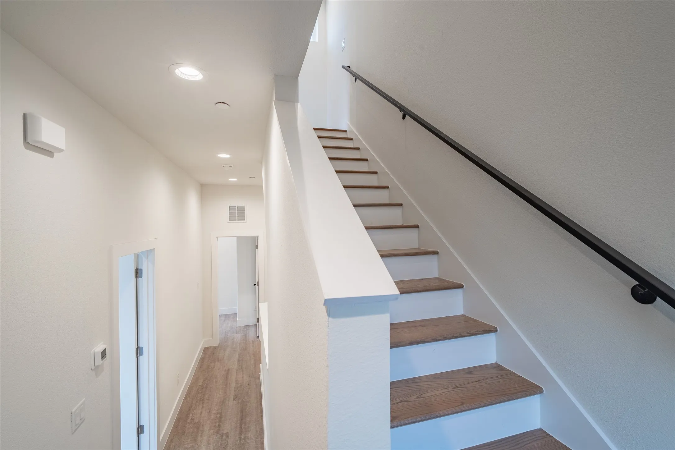 Staircase with wood-type flooring