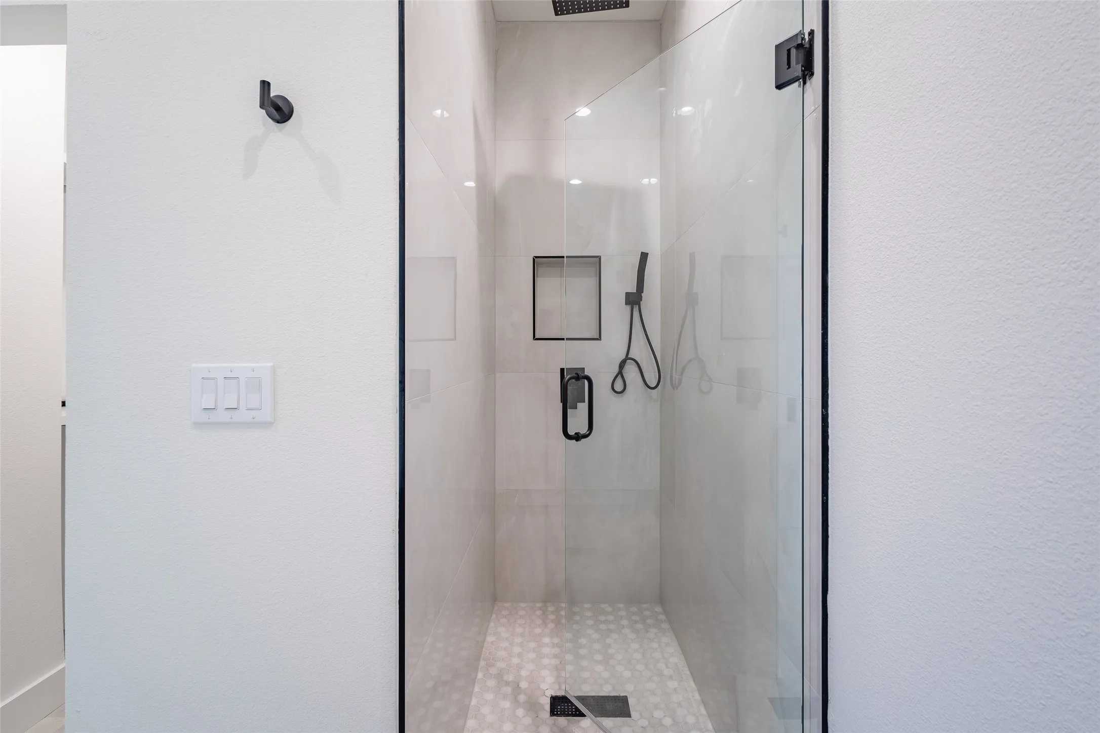 Bathroom featuring a shower with shower door