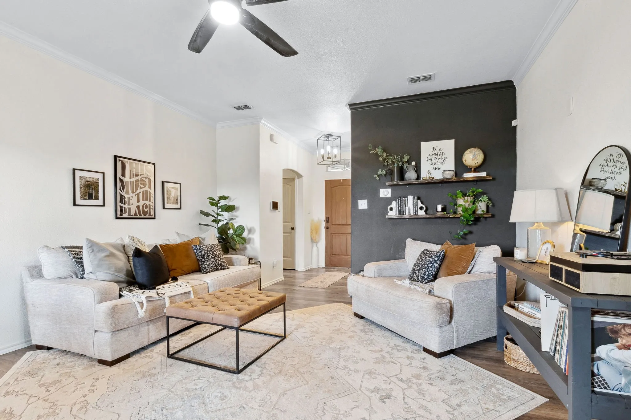 Black accent wall has been repainted the same neutral tone as other wall since these photos were taken