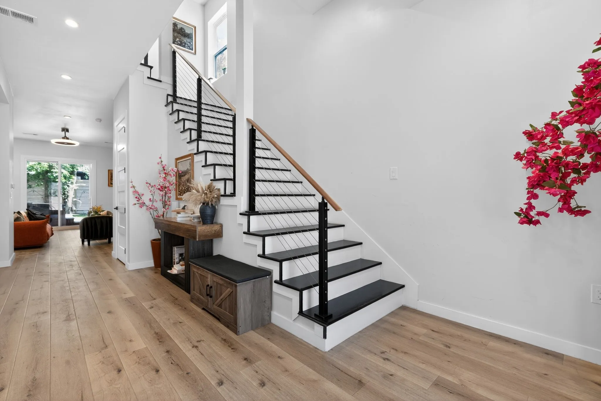 Wide plank wood-finish flooring throughout