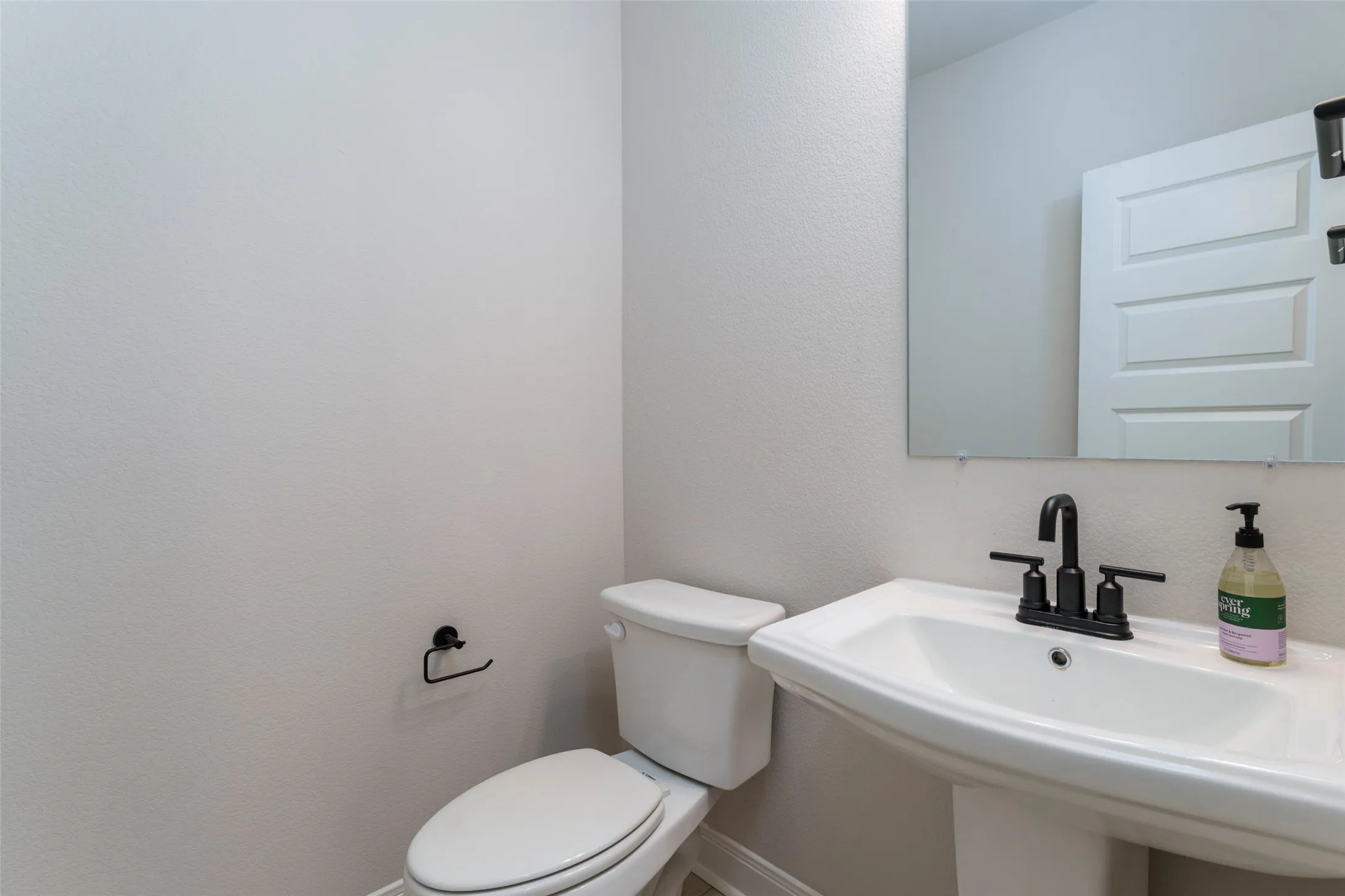Half bath downstairs for guests to use.
