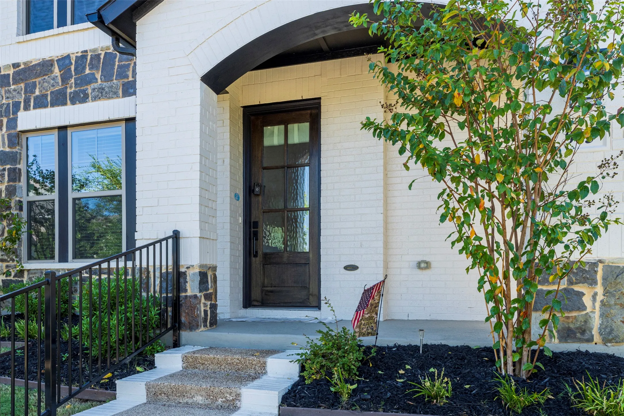 Lovely front porch to sit and watch your neighbors and children in the park.