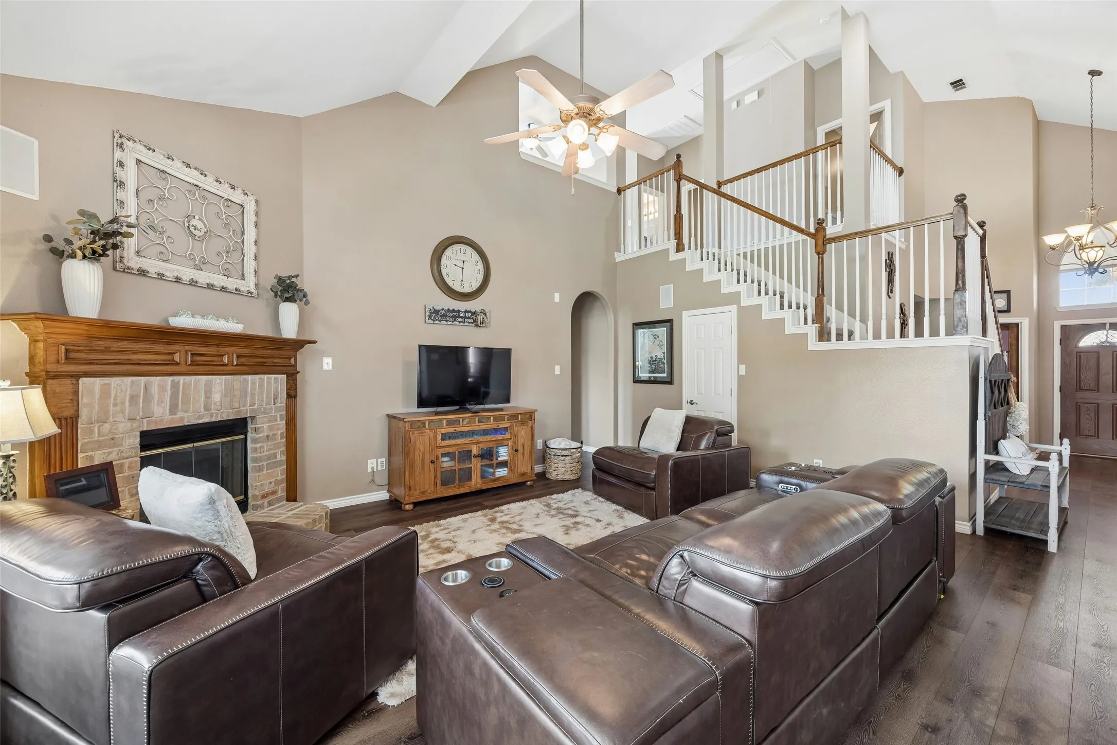 Easy Everyday Connection Between Living and Kitchen — A pass-through breakfast bar places casual seating directly between the family room and kitchen, creating a practical spot for quick meals, conversation, or keeping company with whoever is cooking.