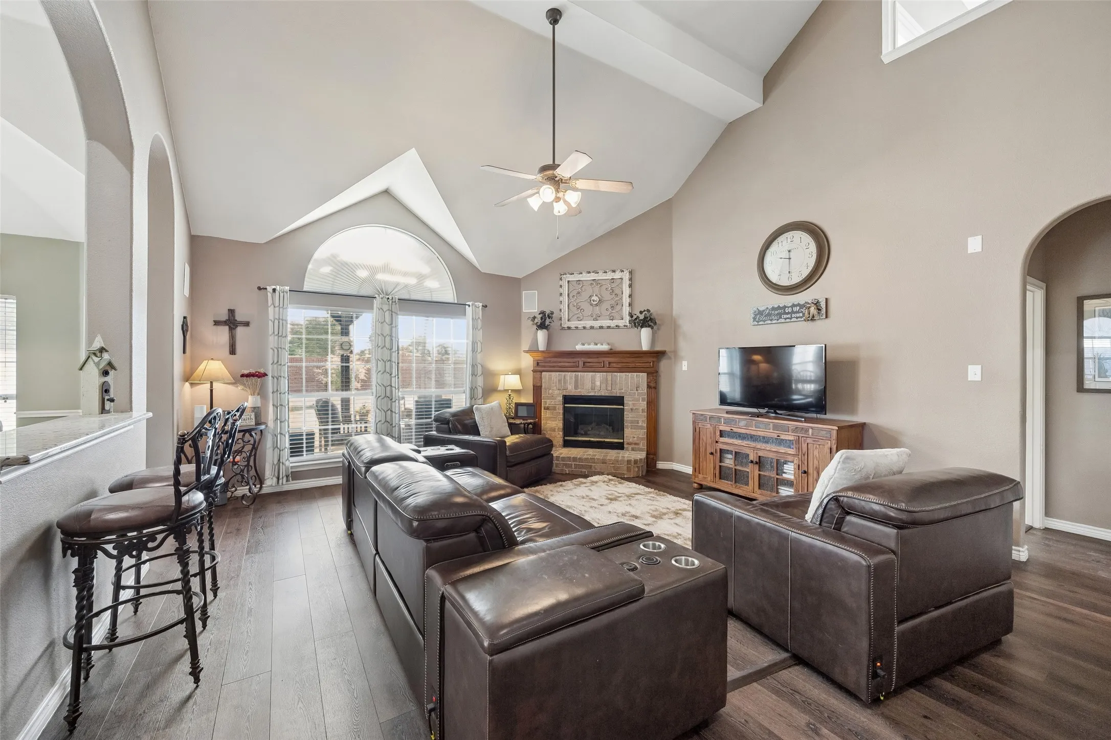 Two-Story Volume Adds to the Sense of Space — This angle shows how the family room opens vertically toward the upstairs landing and staircase. The open railing preserves sightlines between levels and gives this central gathering space a noticeably larger feel.