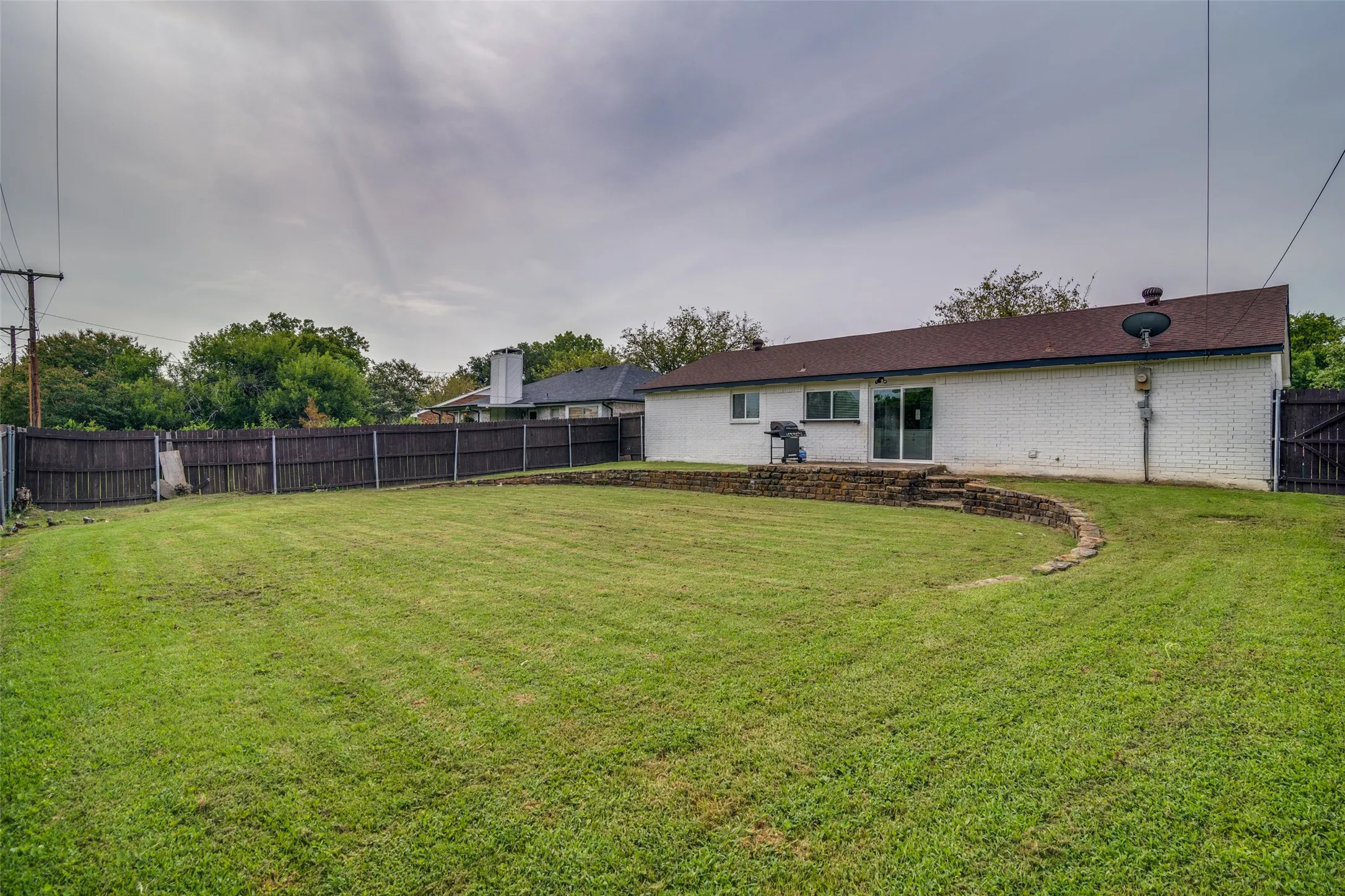 View of fenced backyard