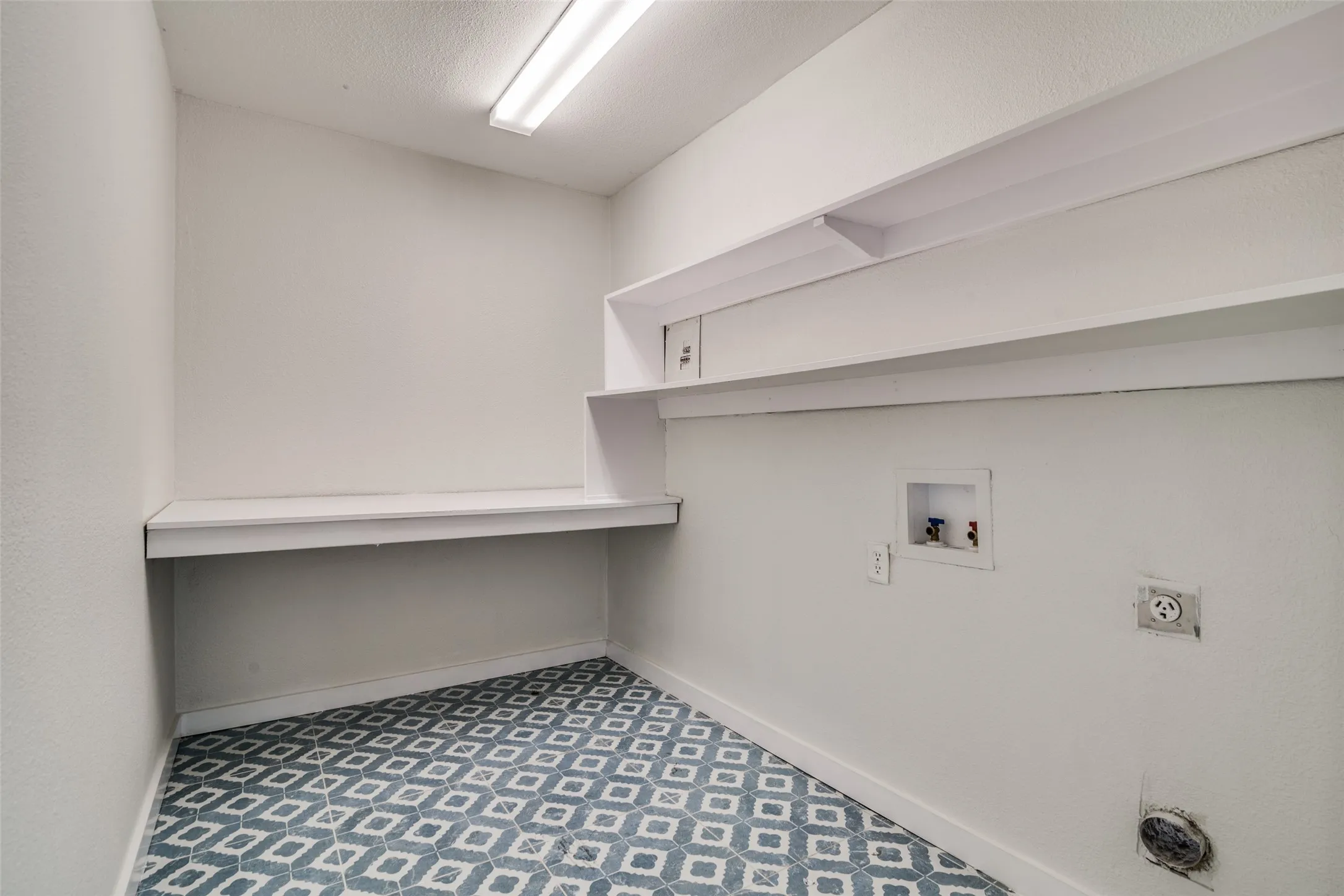 Laundry room featuring washer hookup and electric dryer hookup