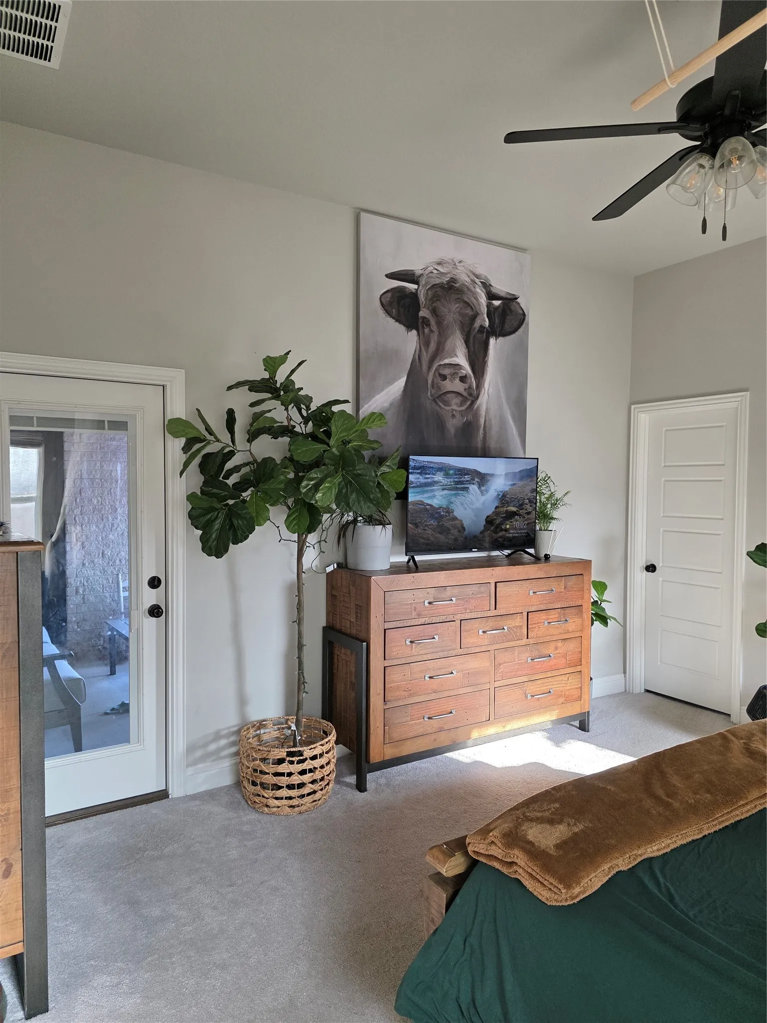 Bedroom featuring ceiling fan and access to outside