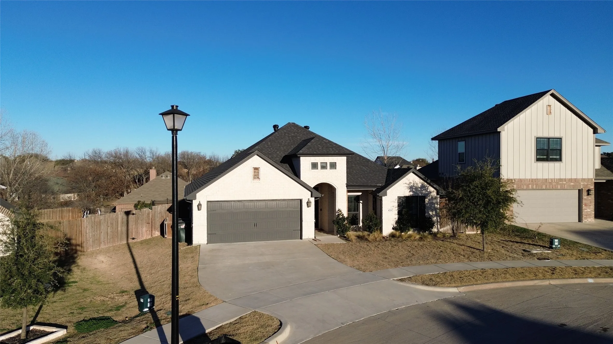 View of front facade featuring concrete driveway