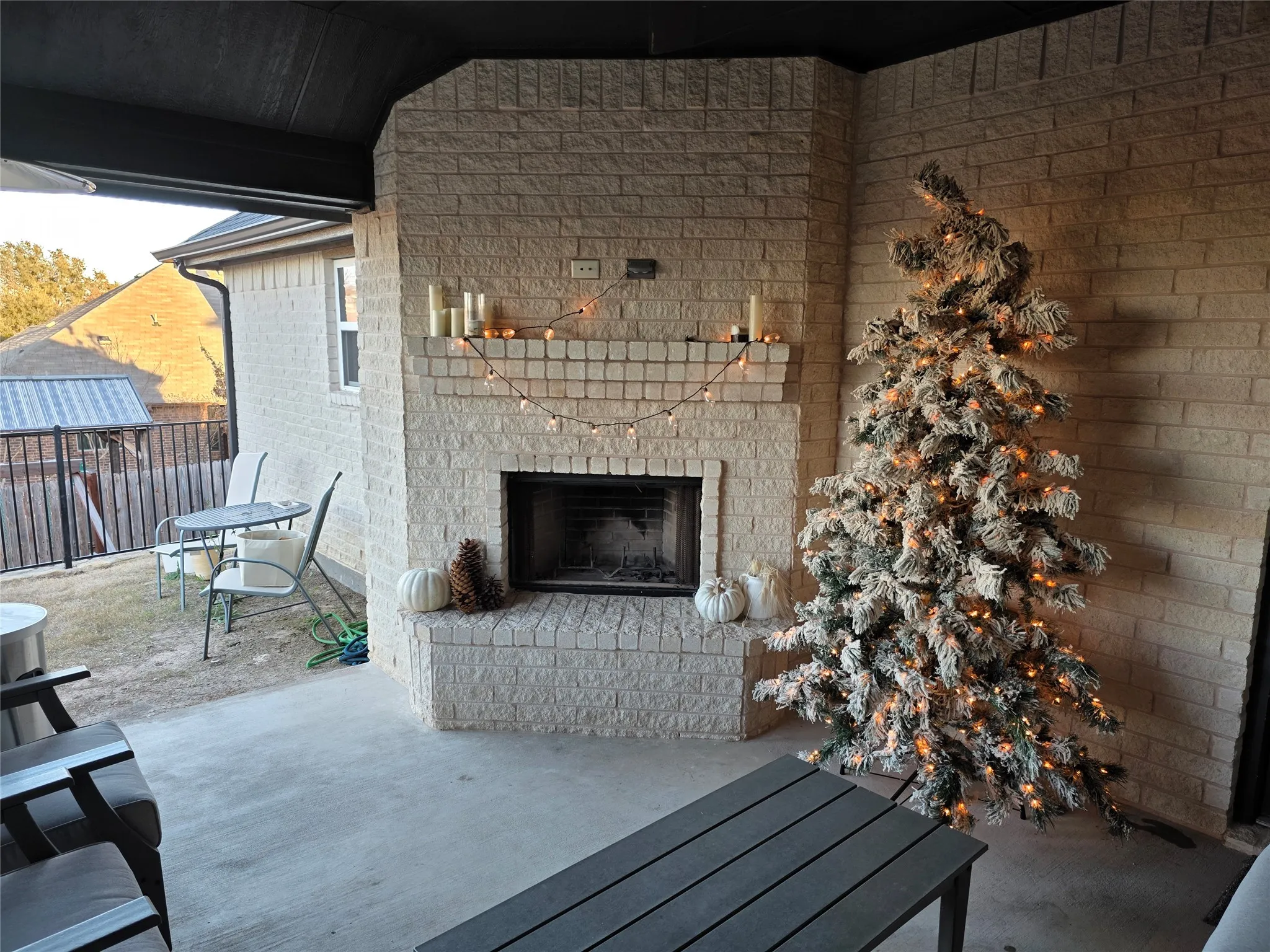 View of patio / terrace with an outdoor brick fireplace