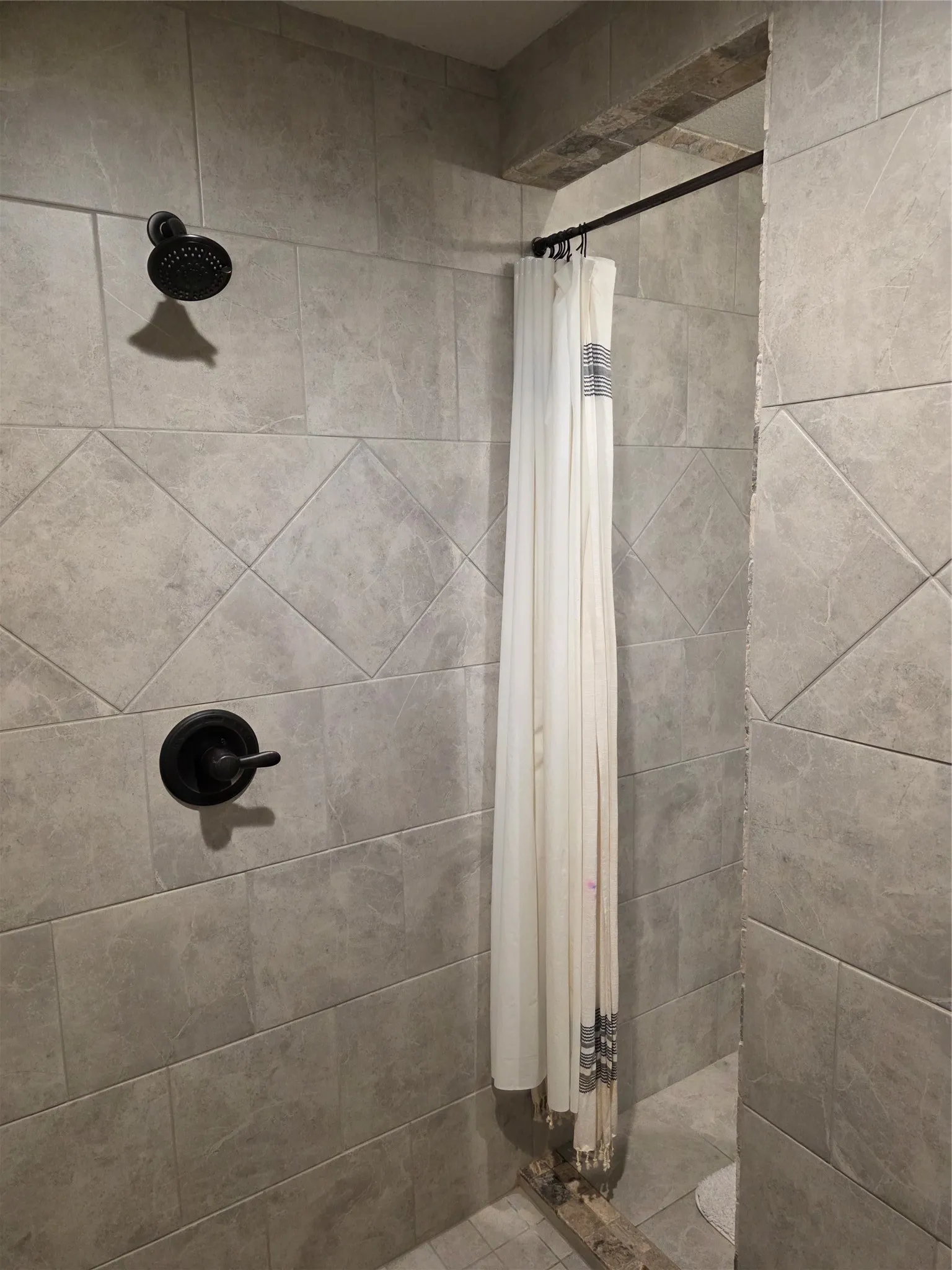 Bathroom with a tile shower