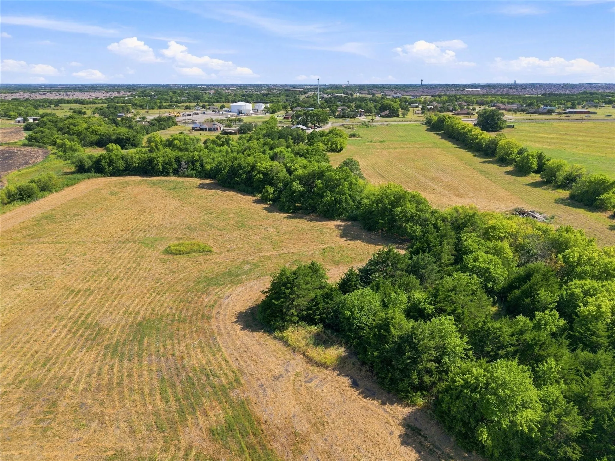 Expansive acreage featuring mature trees and open fields