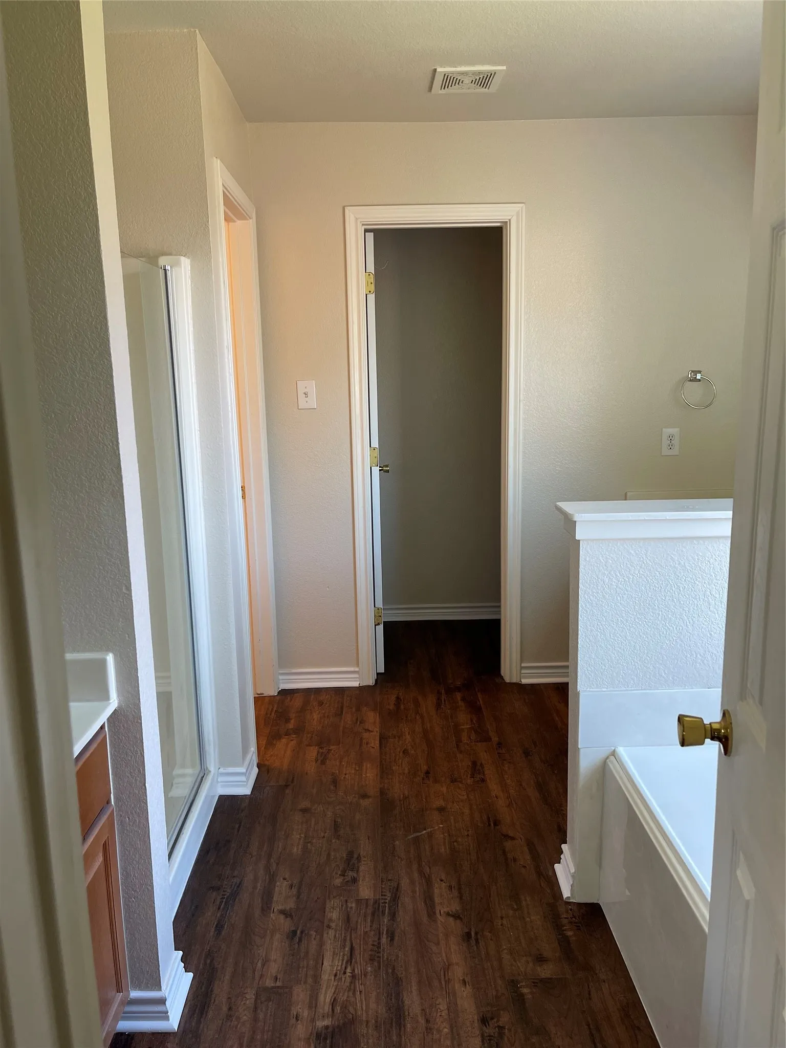 Corridor featuring dark hardwood / wood-style floors