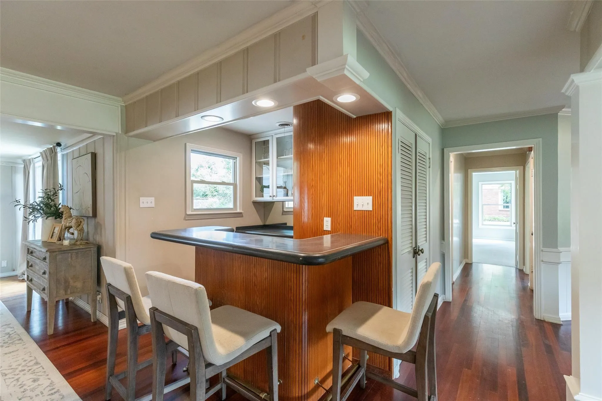 one-of-a-kind wet bar in between formal & secondary living areas