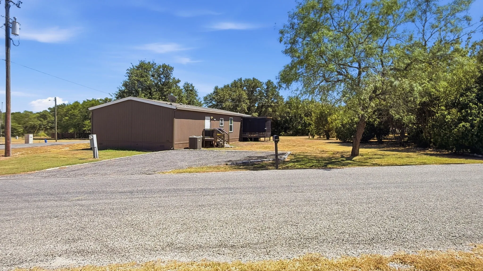 Side view of home with additional parking area