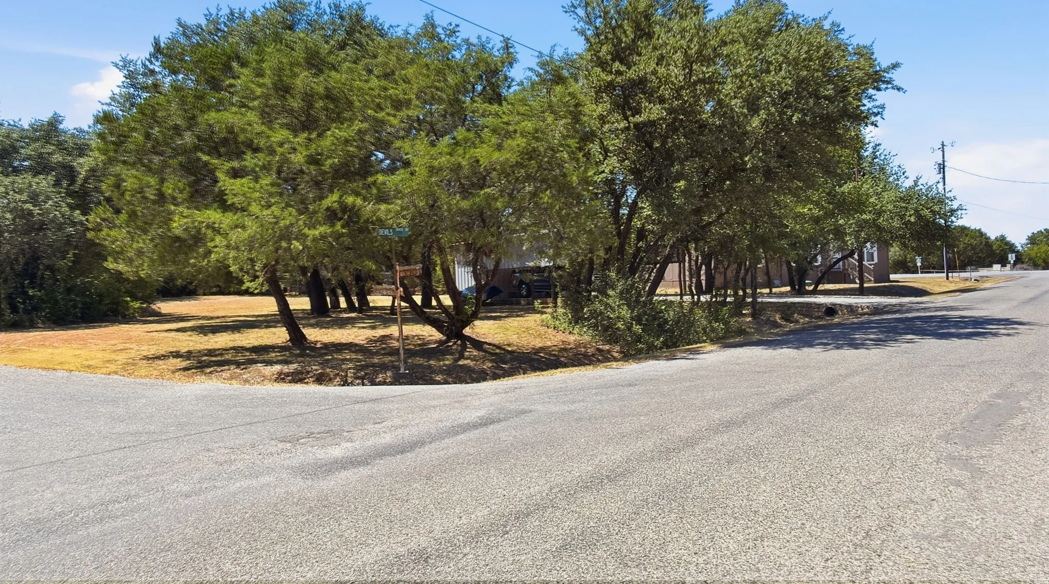 Side view of lot with carport and garage