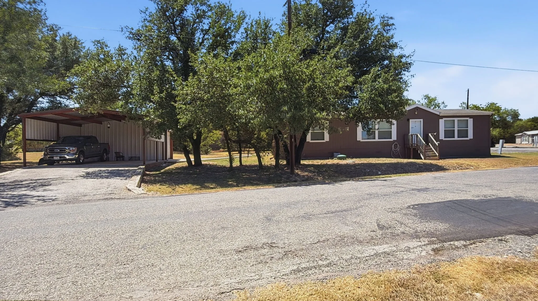 Located on 2 lots! Detached carport/garage