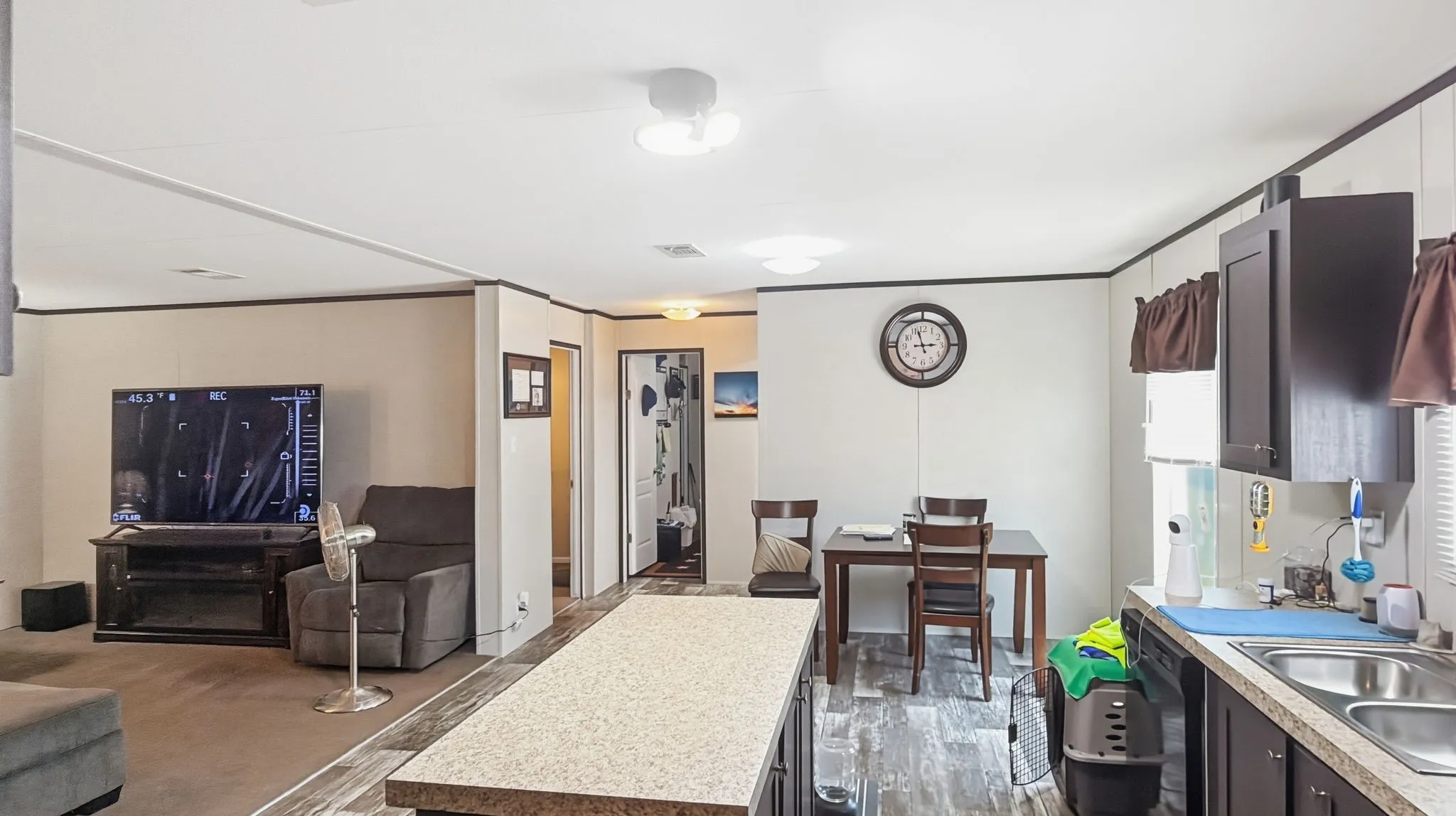 Kitchen, breakfast, and living room view.