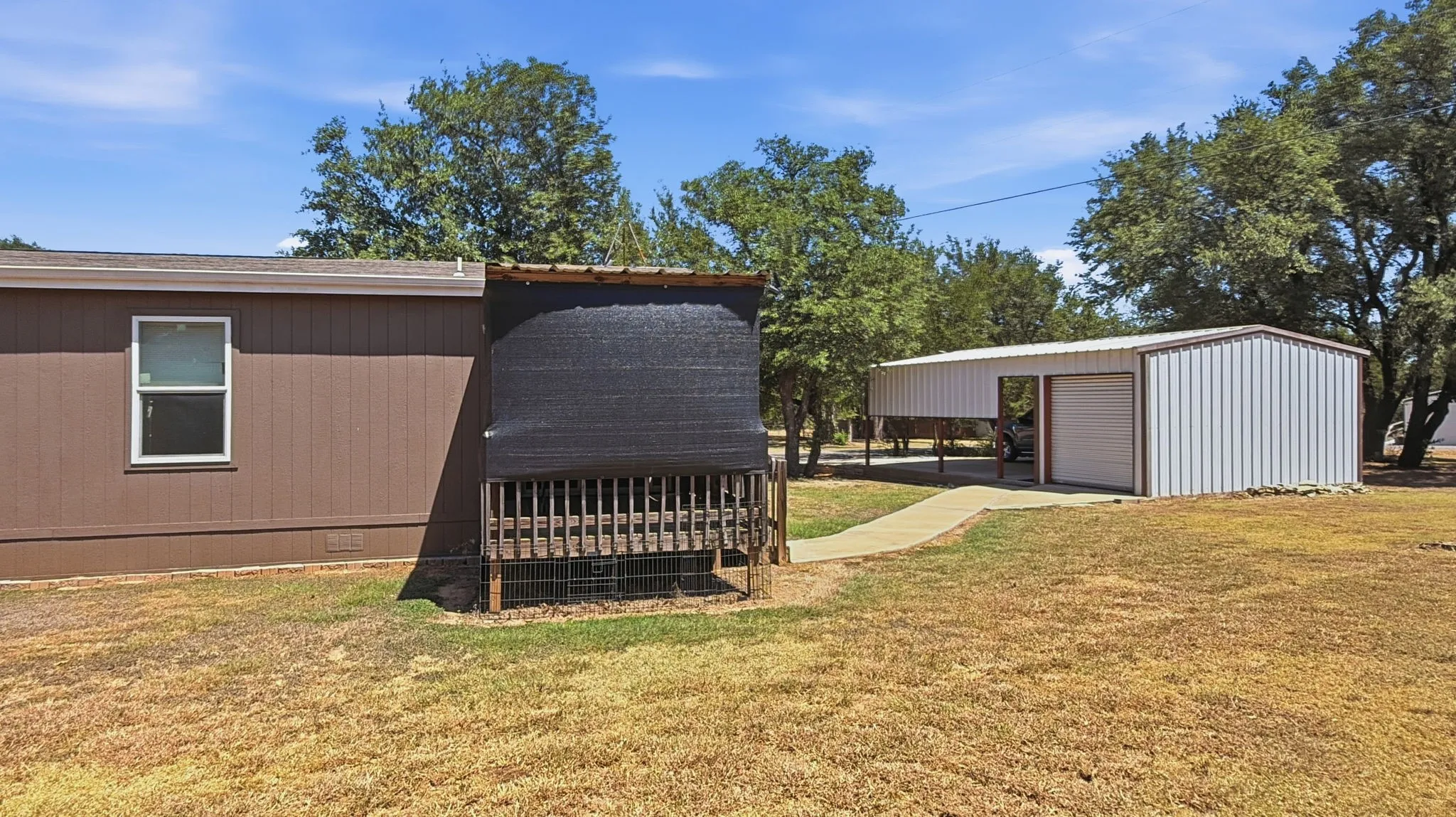 Back view of home and carport/garage