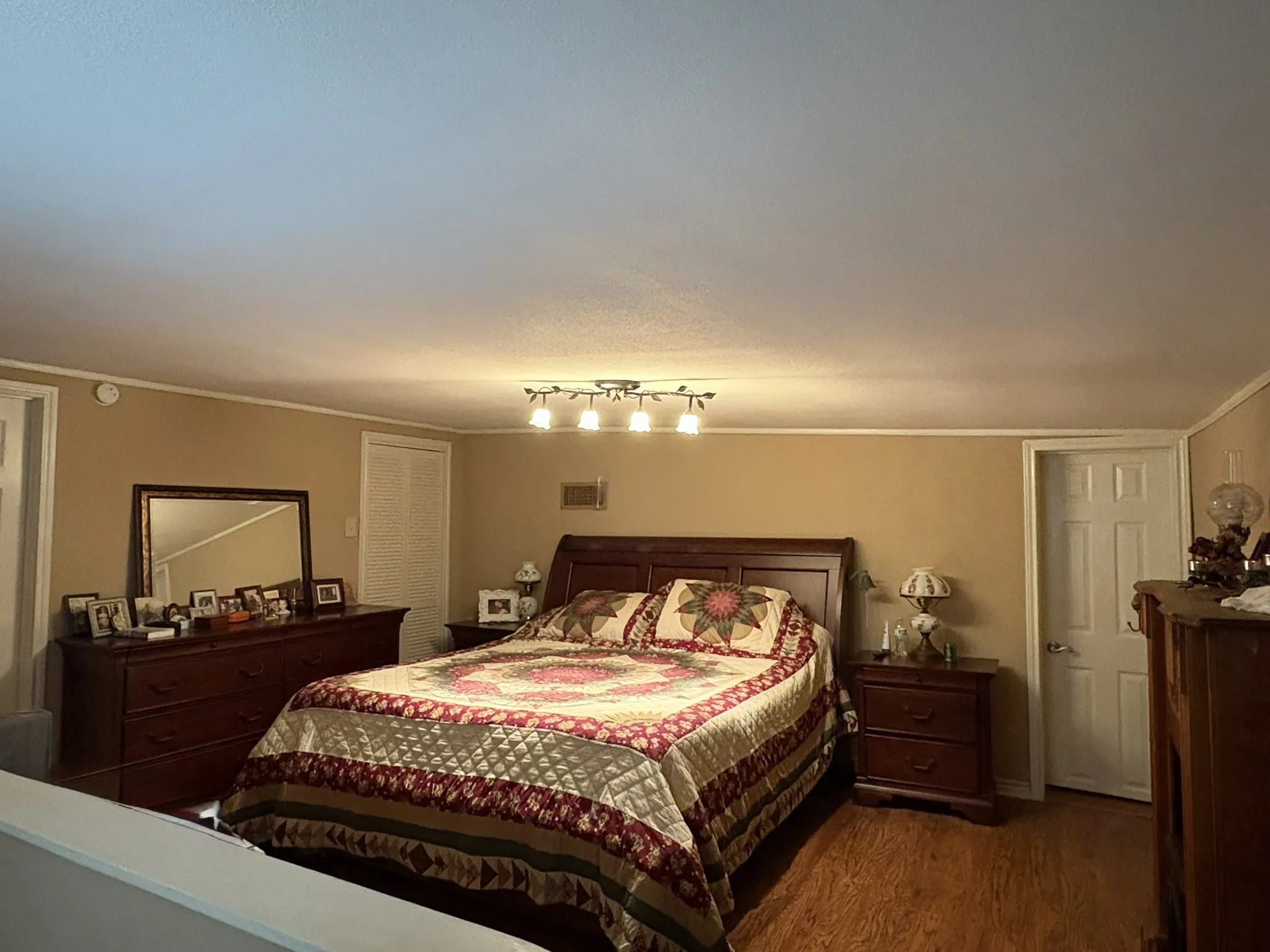 Wood-finish flooring with neutral wall tones and white trim