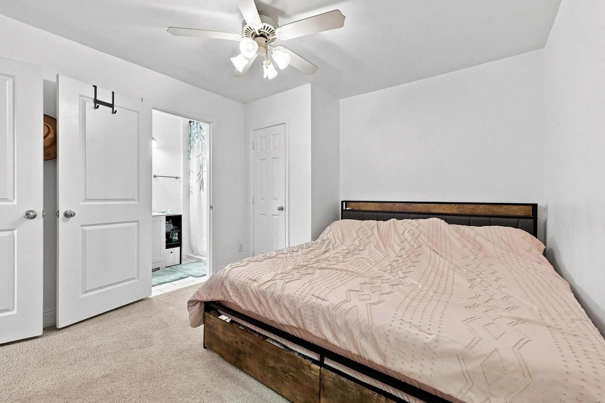 White interior walls with a ceiling fan light fixture