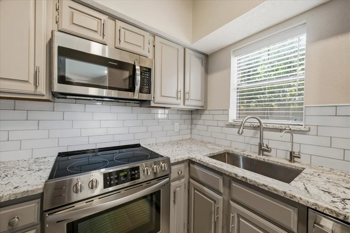 Appliances, painted cabinets, granite undermount stainless sink, everything has been updated!