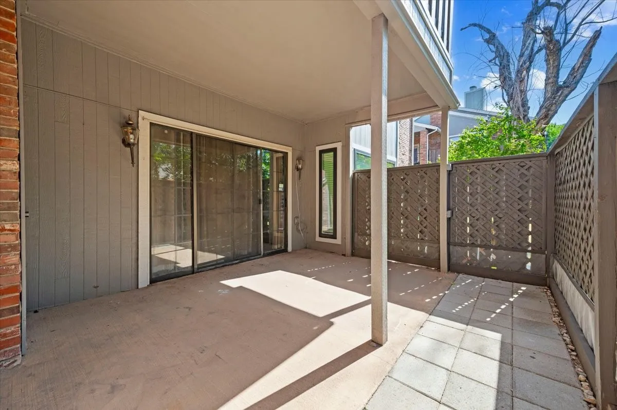 View of French sliding doors and the beautiful large patio space.