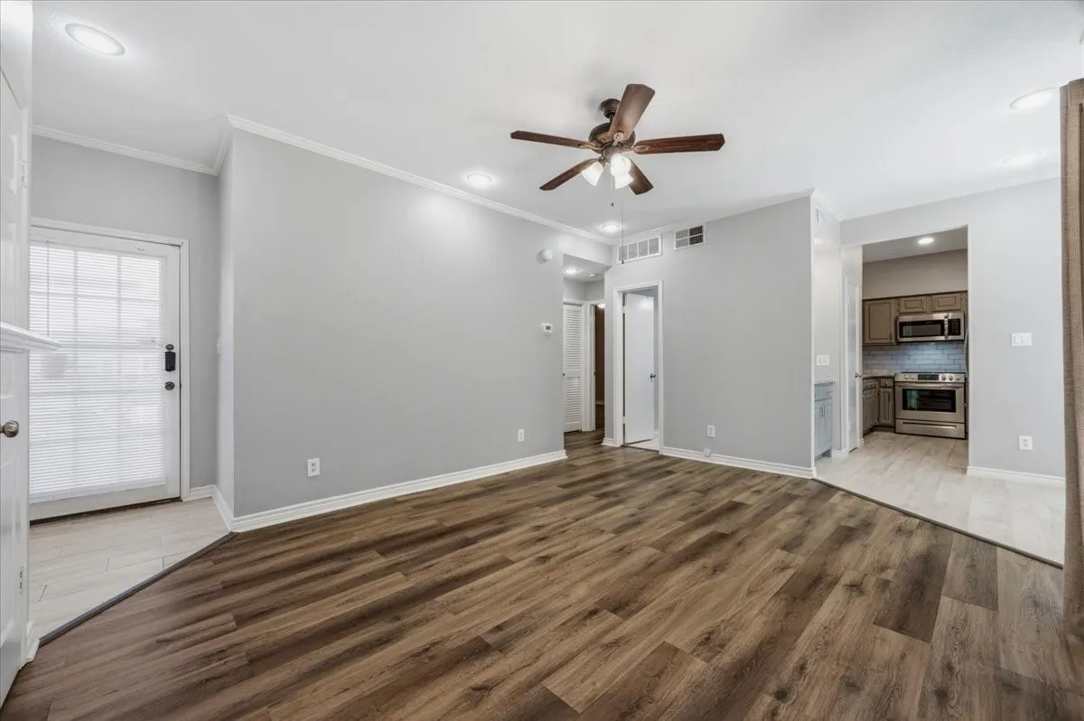 Entry door to the left, dining, coffee bar and kitchen are to the right. Beautiful!