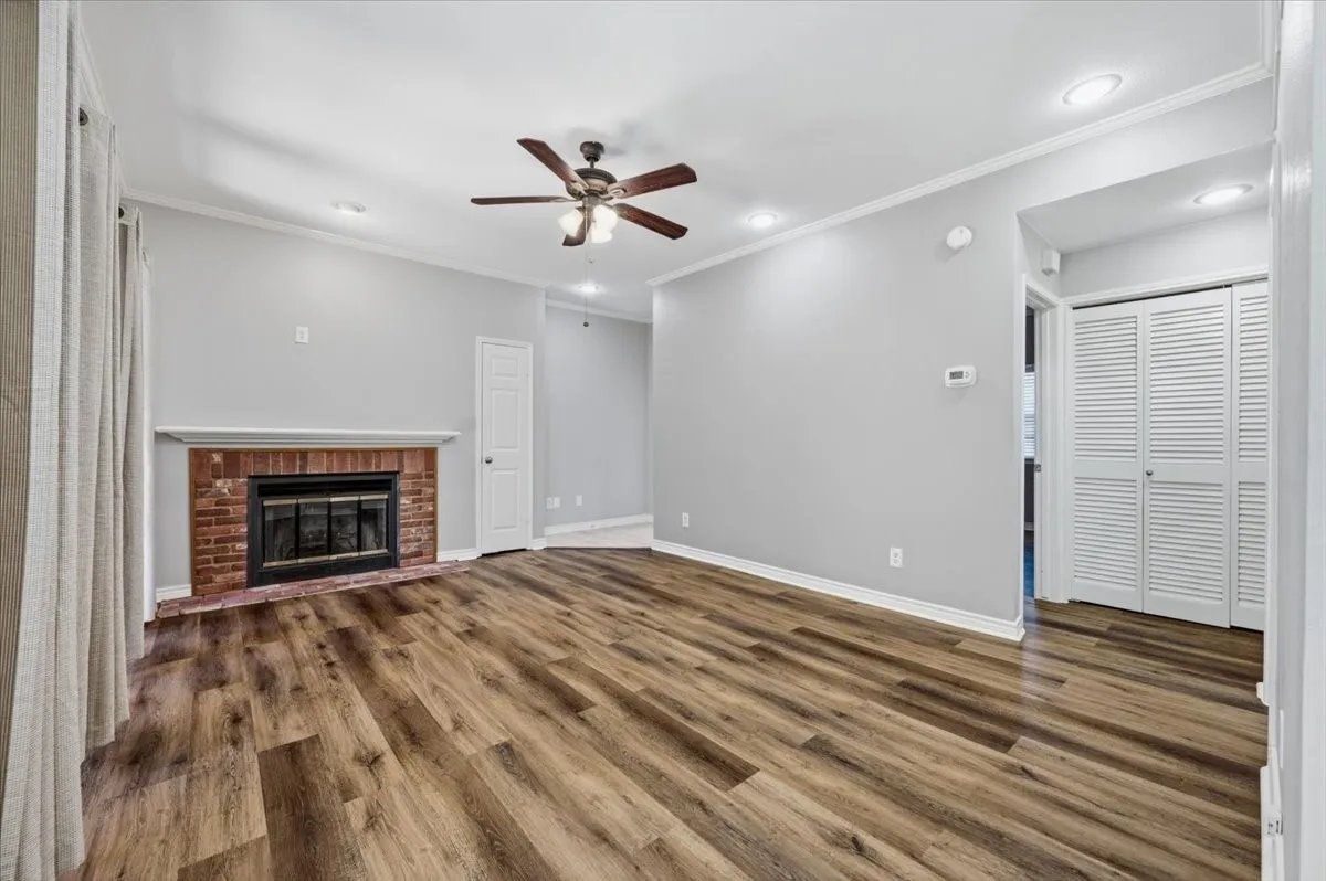 Wood burning fireplace for cozy winter evenings. Louvered doors hide the laundry room.