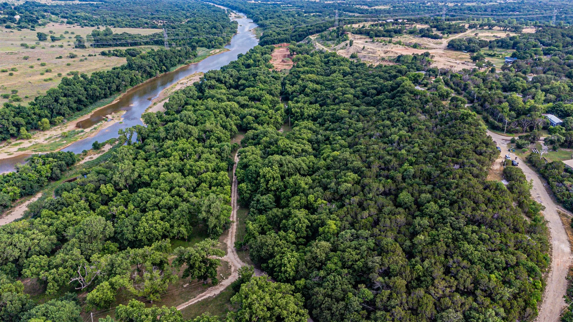 Riverfront property featuring extensive mature tree coverage