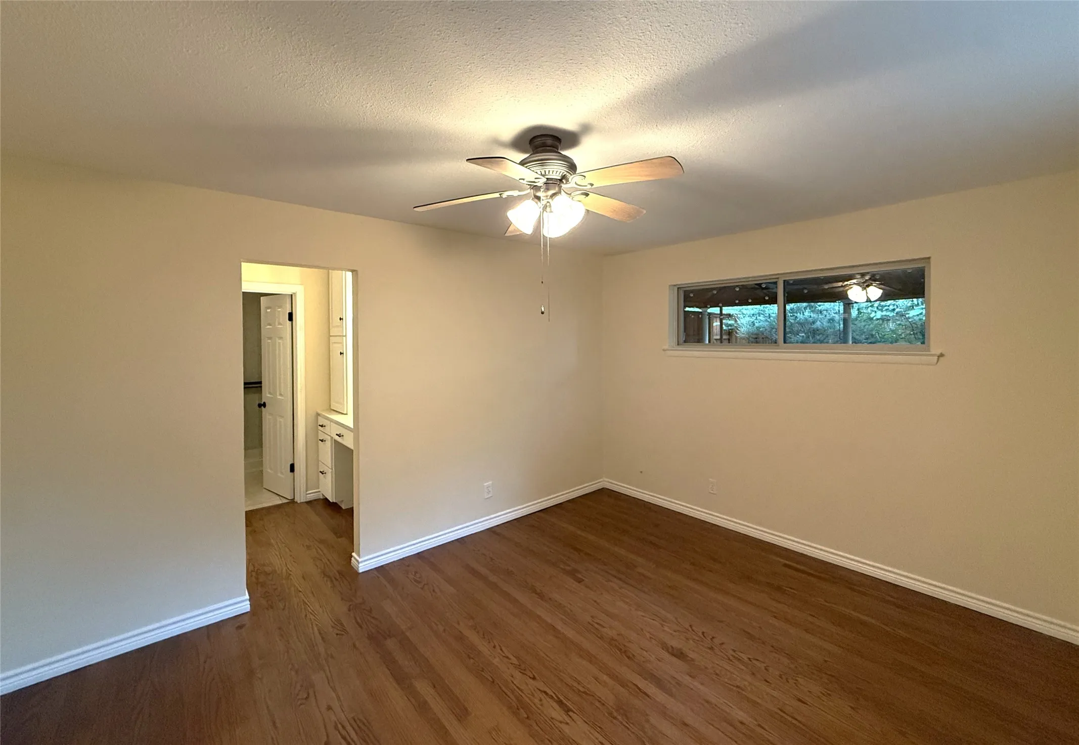 Primary bedroom and entry to dressing area and walk in closet