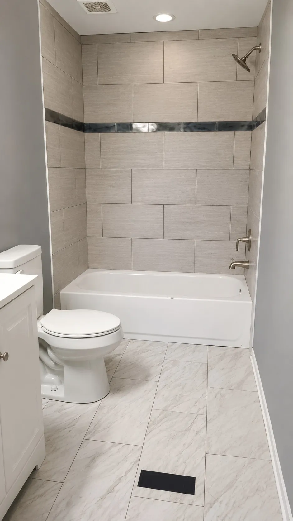 White porcelain bathtub with a brushed nickel showerhead and fixtures