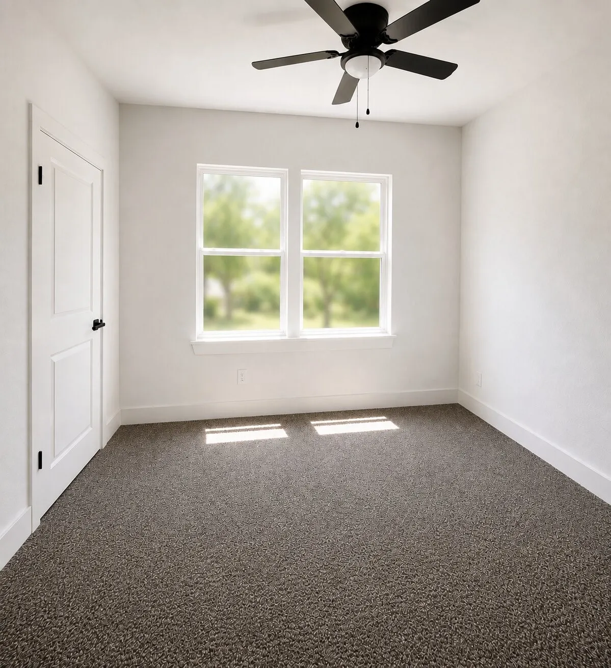 Ceiling fan with integrated lighting, two paneled windows, white trim, textured carpet, and a paneled door