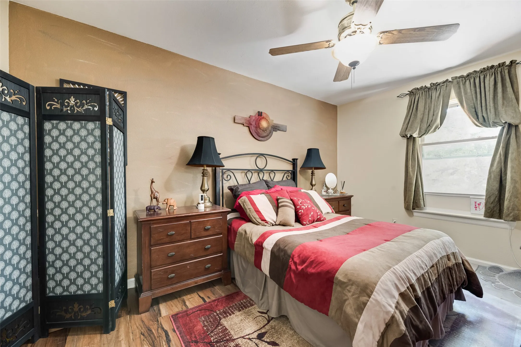 Wood-finish flooring with a decorative area rug
