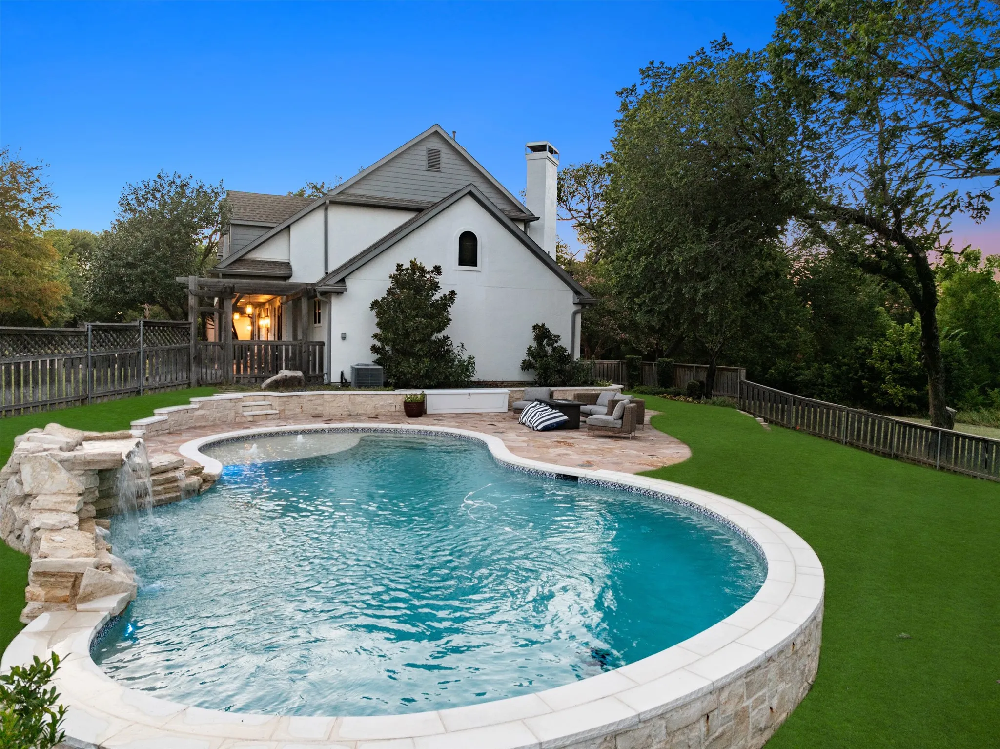 Resort-style pool tucked into a beautiful natural setting.