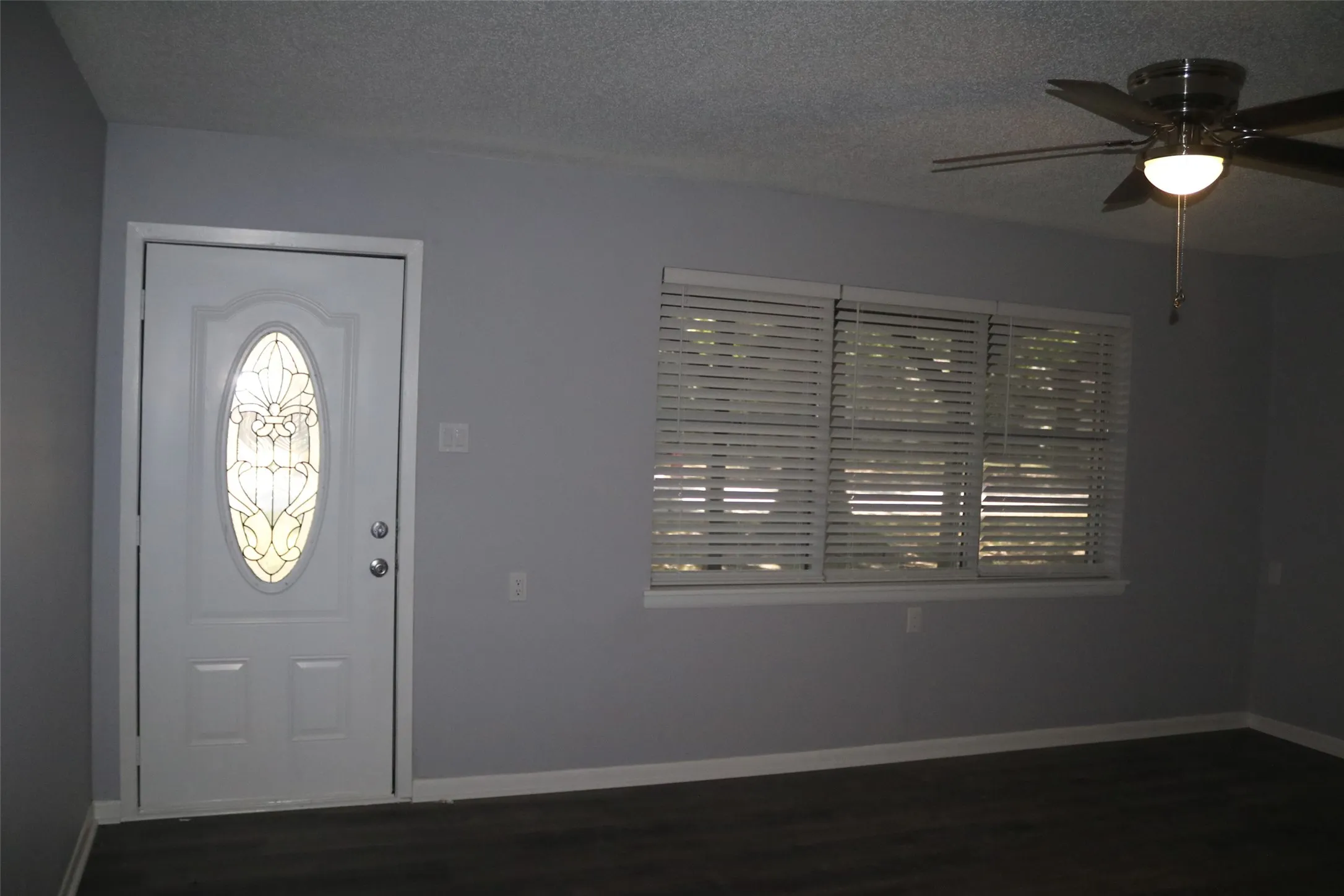 White entry door with decorative glass inlay