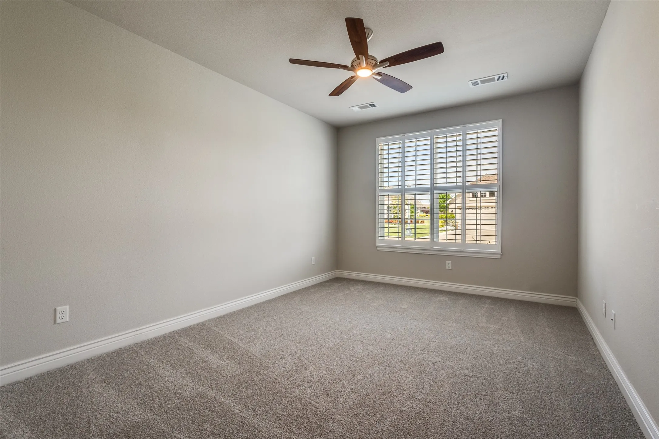 YOU WILL SEE THIS ROOM VACANT WITH NEW CARPET, PLANTATION SHUTTERWS AND CEILING FAN.
