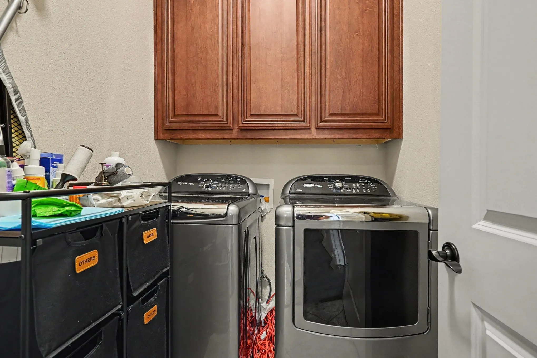 Built-in wood-finish cabinetry provides storage