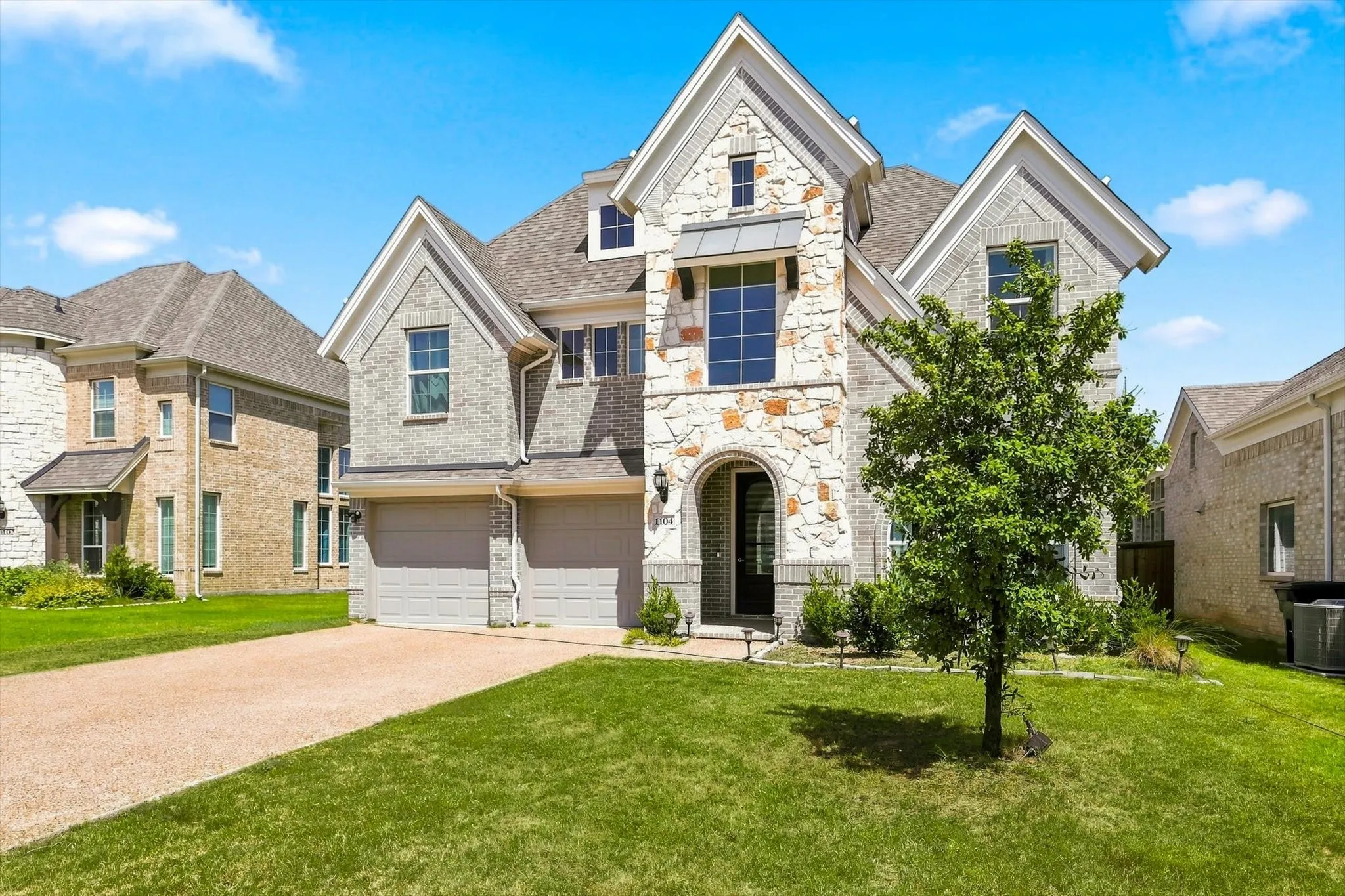Stone and brick facade with multiple gables
