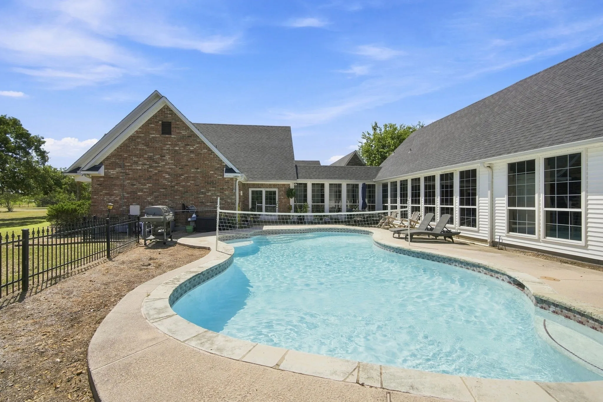 Sparkling in ground gunite swimming pool