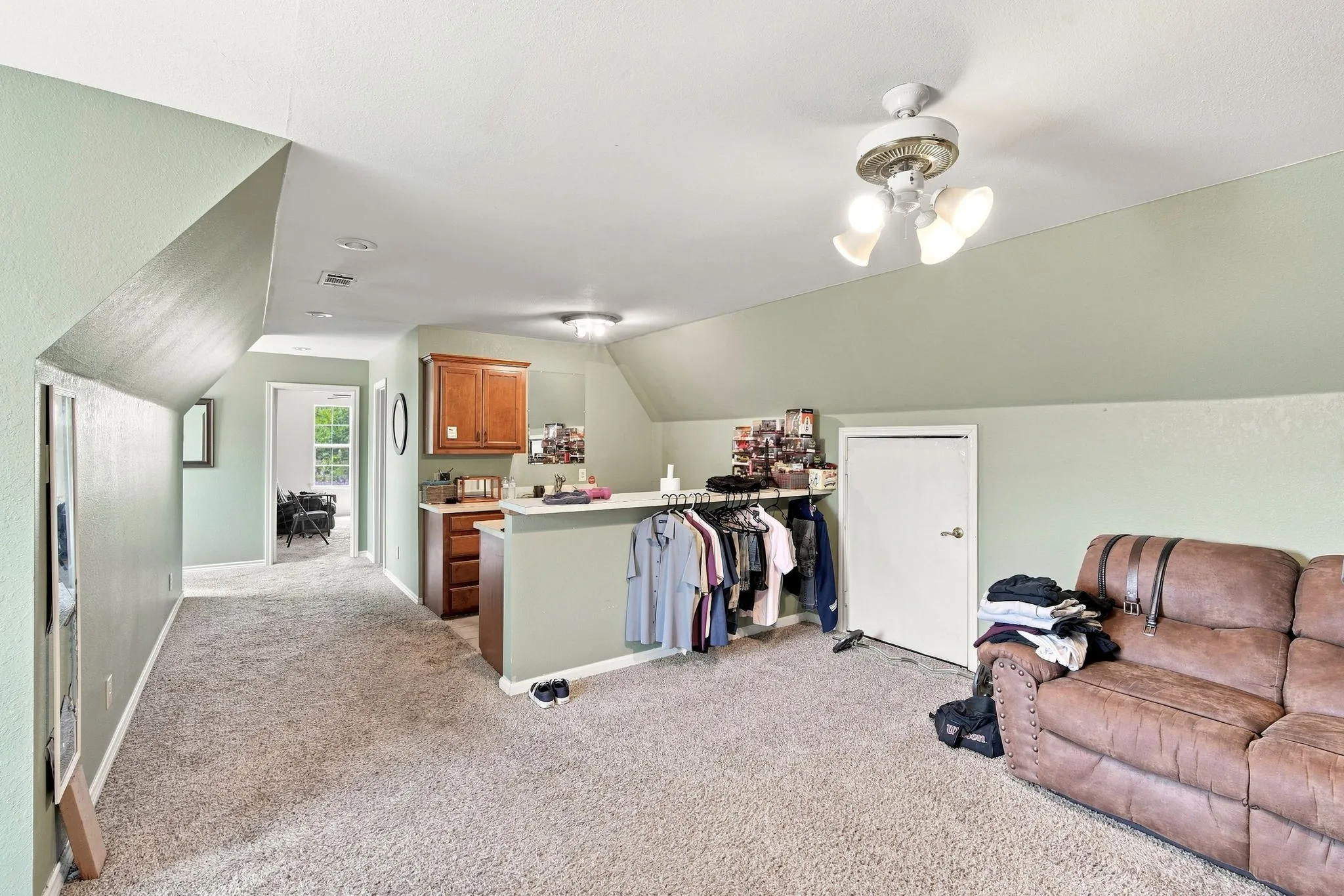 Flexible space above garage aka “apartment”
Featuring living area and kitchenette