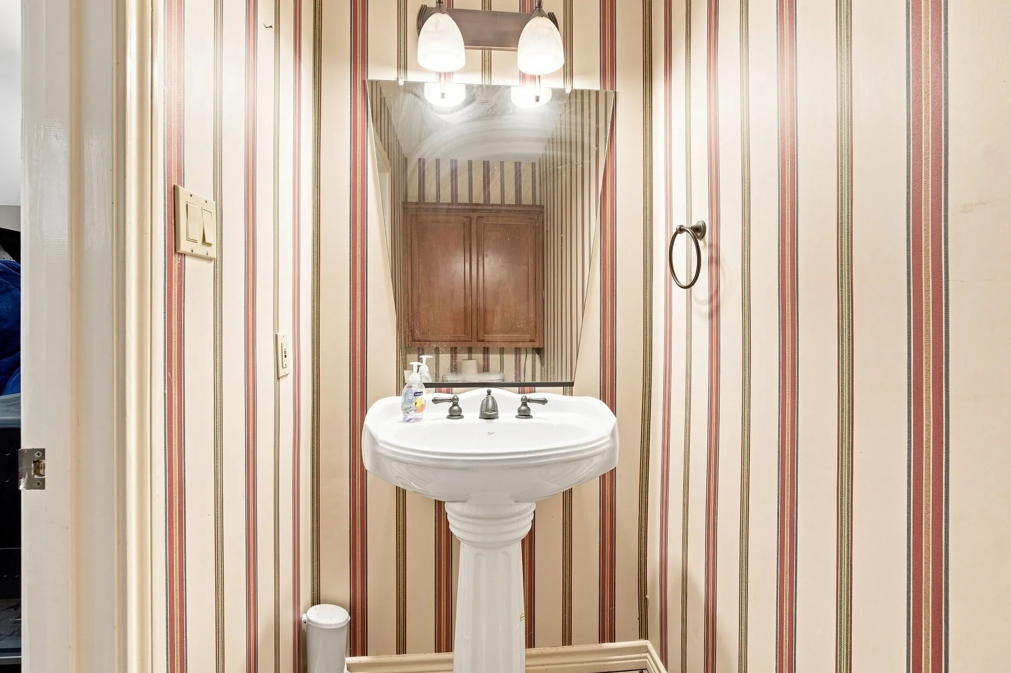 gameroom powder room with pedestal sink